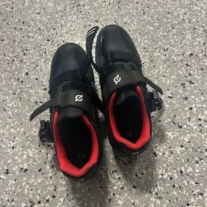 Peleton cycling shoes for peleton bikes in black and red